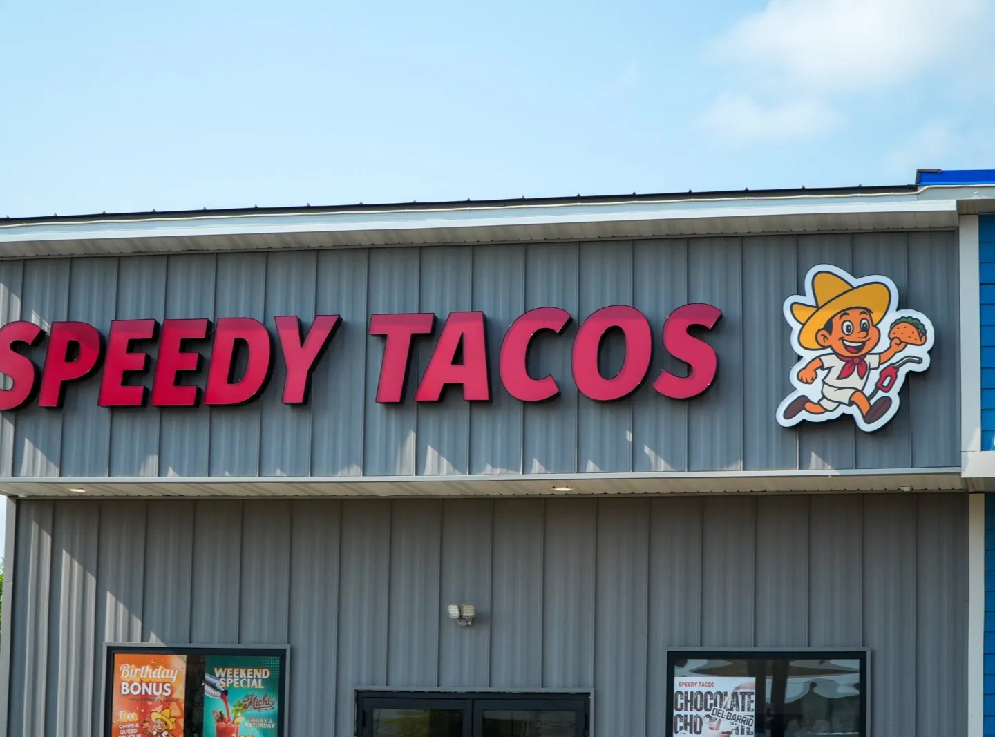 The Eau Claire store from the parking lot, with the Speedy Tacos entrance and windows