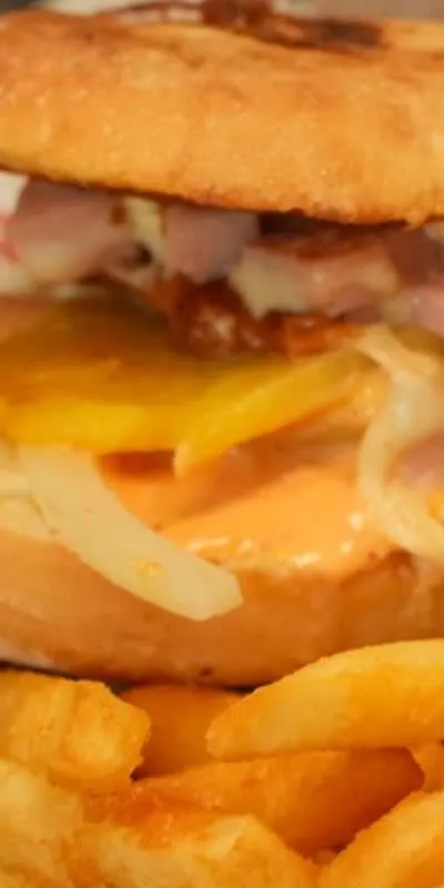 The Hawaiana torta and fries in a basket lined with Speedy Tacos paper